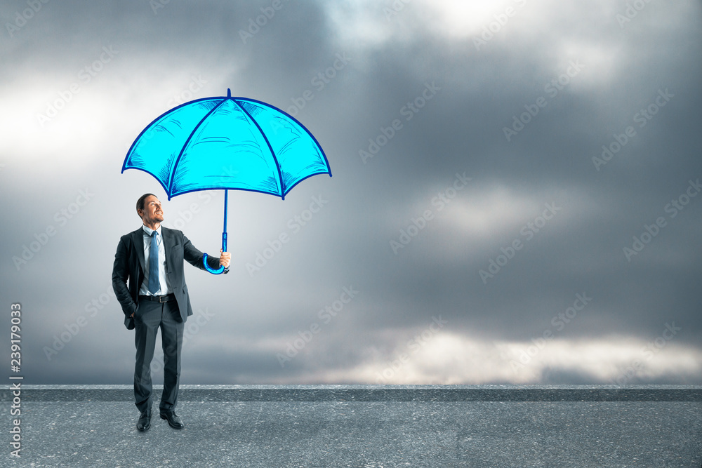 Businessman holding blue umbrella Businessman holding blue umbrella