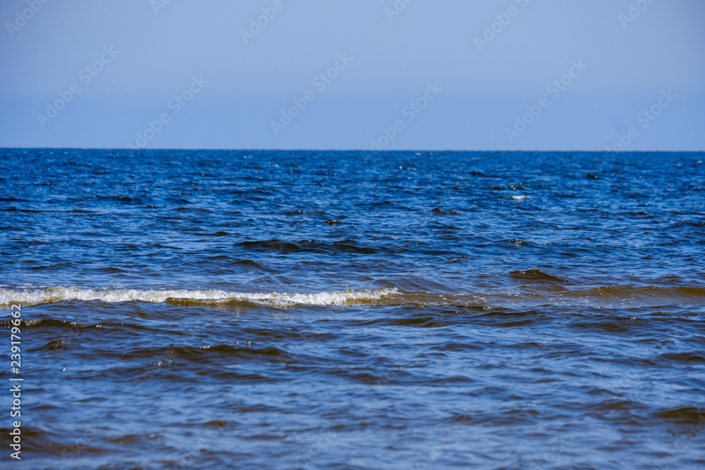 Obraz premium lakeside beach details with sand, rocks and blur background