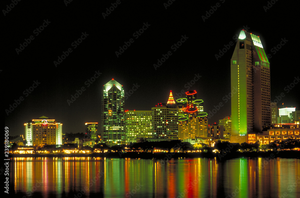 Fototapeta premium Reflection of lights on San Diego skyline at night seen from Coronado Island