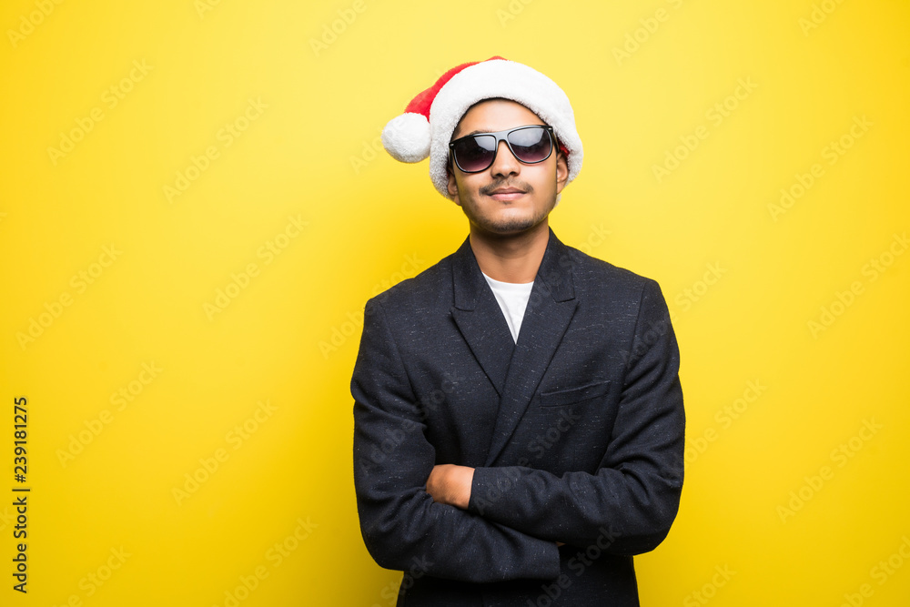 Christmas Concept. Handsome indian man wear santa hat on white isolated background. Christmas Concept. Handsome indian man wear santa hat on white isolated background.