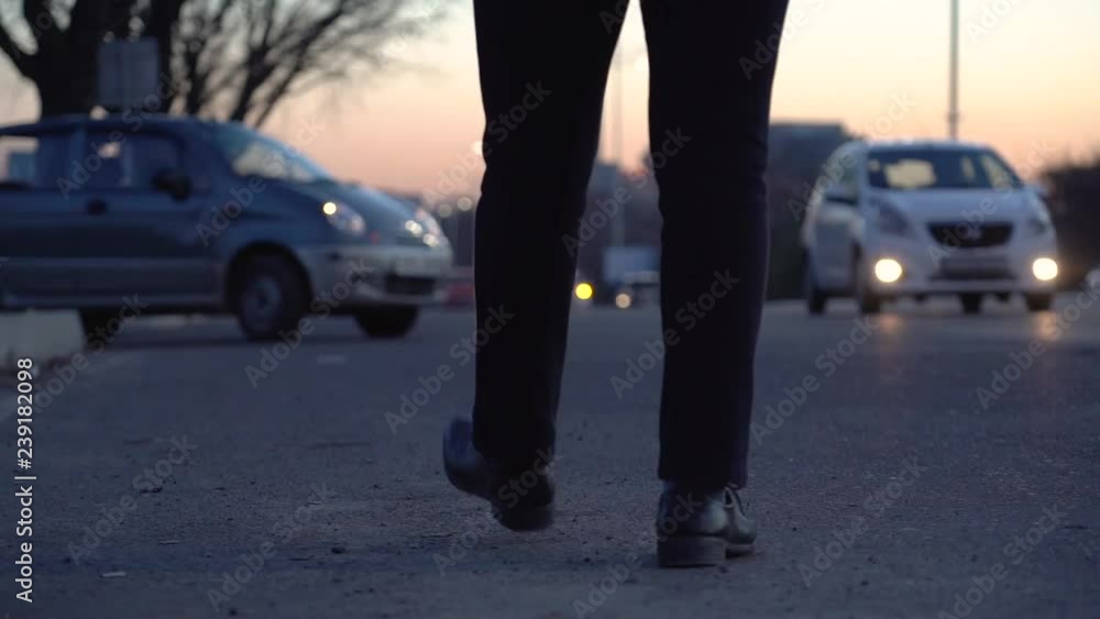 Night road in the city, a man came to catch a taxi, a man goes against the traffic