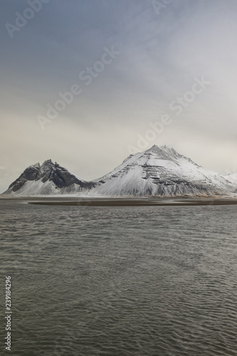 Snowy mountain, sea and beach
