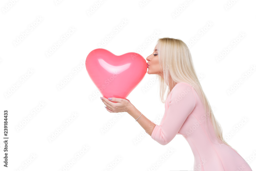 Beautiful young blond woman with heart shape pink air balloon on white isolated background. Woman on Valentine's Day. Symbol of love - Image Beautiful young blond woman with heart shape pink air balloon on white isolated background. Woman on Valentine's Day. Symbol of love - Image