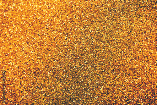 Golden glitter textured background for christmas and new year celebration party.