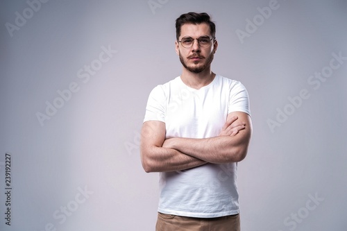 Handsome young guy posing in studio - isolated
