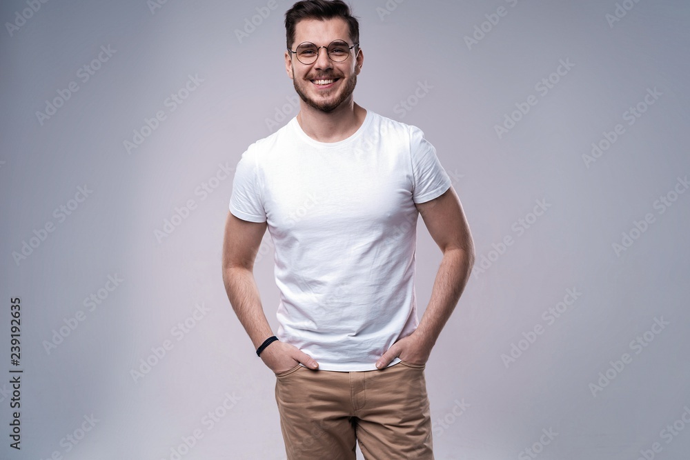 Handsome young guy posing in studio - isolated Handsome young guy posing in studio - isolated