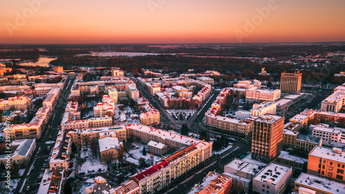 Beautiful sunset on the background of a European city with a copter. Gomel. Belarus. © firairo