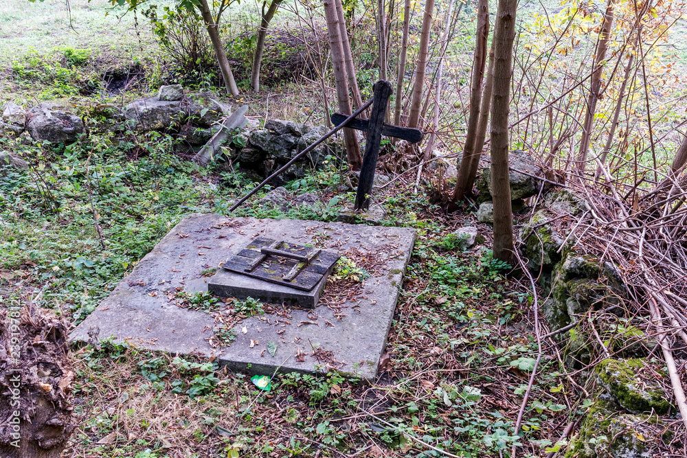 Holy spring of living water, moss-covered walls, autumn. Holy water ...
