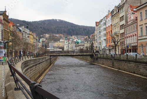 Buildings on the street and the river Tepla Karlovy Vary, Czech Republic.