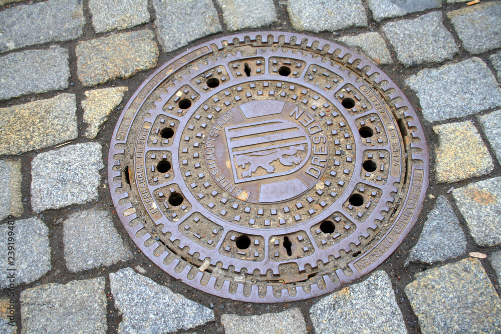 Dresden, Germany, metal sewer cover