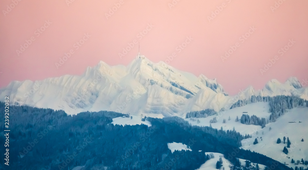 The snow covered Santis peak (2502 m), the highest mountain in the Alpstein massif of northeastern Switzerland and the  culminating point of the Appenzell Alps.  - obrazy, fototapety, plakaty 
