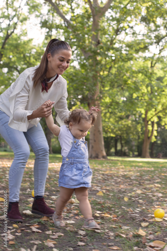 Fototapeta premium Baby girl learning walking.