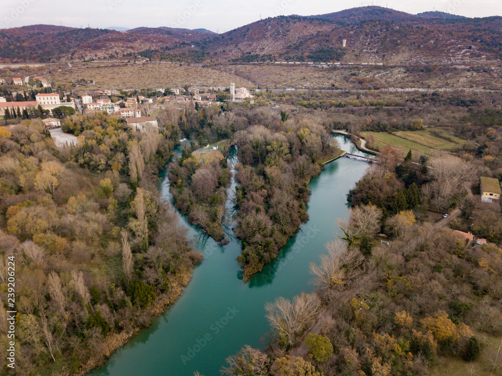 Fototapeta premium The Timavo River (Il fiume Timavo, Timava, Timav) is a two-kilometre stream in the Province of Trieste. It has four sources near San Giovanni (Štivan) near Duino (Devin)