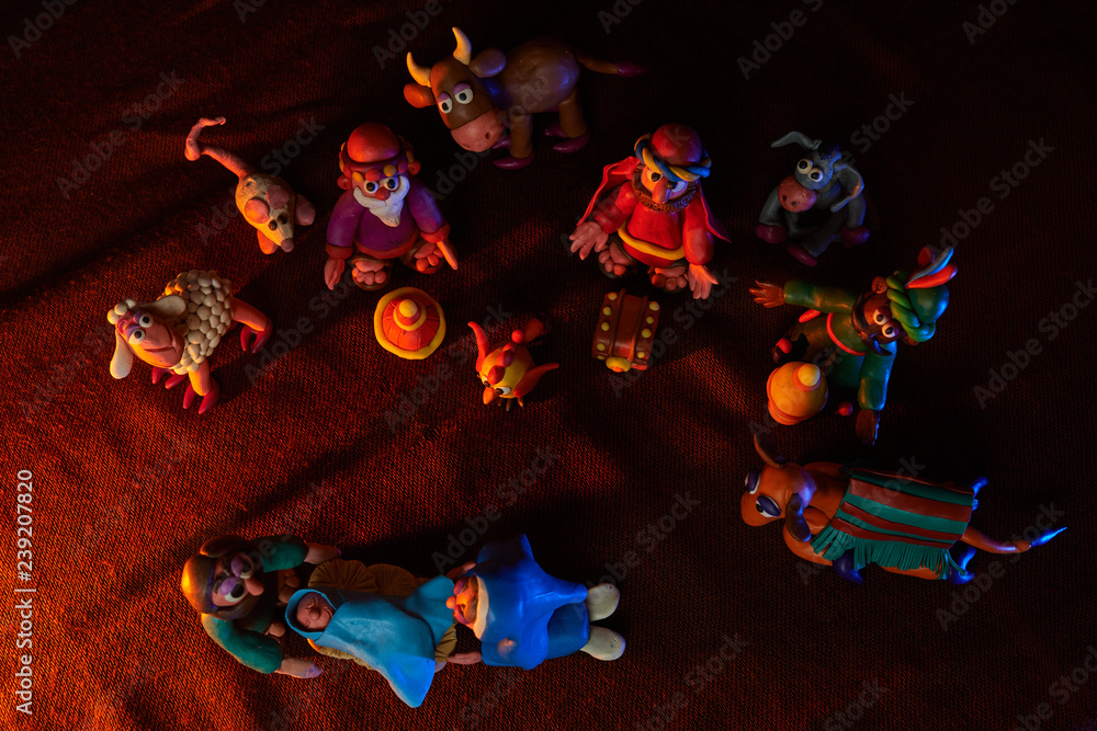 many plasticine figures on the theme of Christmas with beautiful lighting