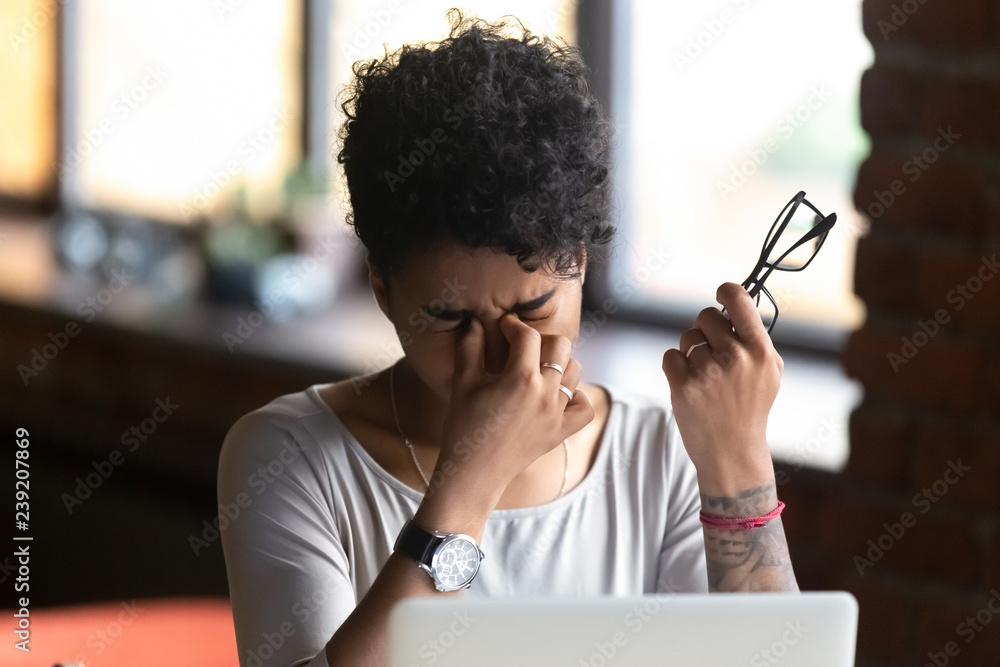 African American woman taking off glasses, feel eye strain, massaging nose bridge, tired female feeling discomfort after long wearing glasses at workplace, work with computer, bad eye vision close up - obrazy, fototapety, plakaty 