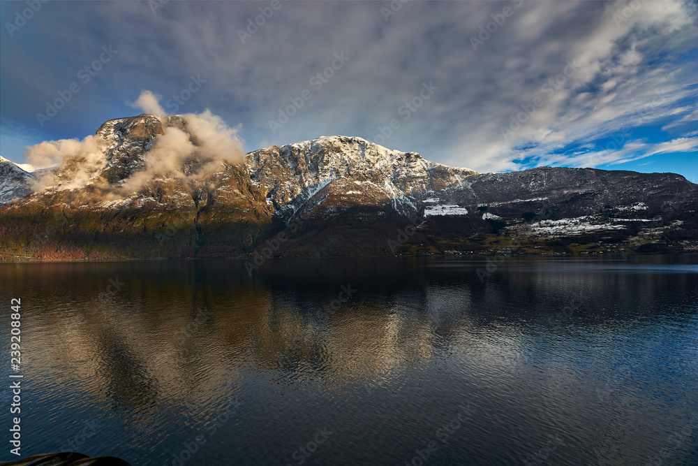 Nærøy fjord in Norway. Landscape of mountains and transparent waters. Spectacular reflections. Dream voyages