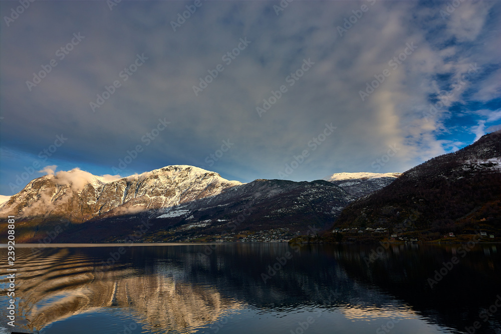 Nærøy fjord in Norway. Landscape of mountains and transparent waters. Spectacular reflections. Dream voyages