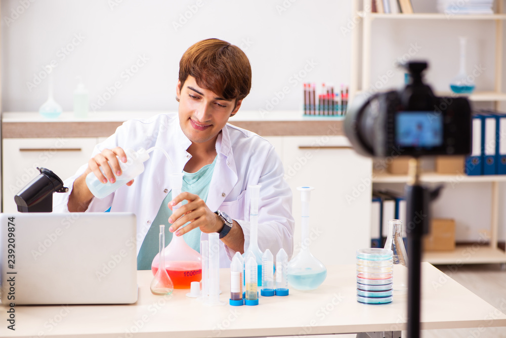 Chemist blogger recording video for his blog Chemist blogger recording video for his blog