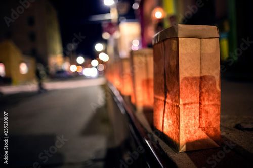 festive luminarias lined along a downtown street