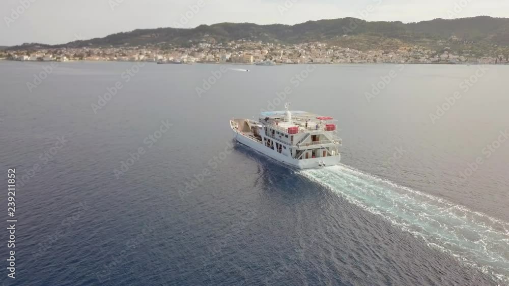 Aerial view of ferry boat with cars going towards Kosta, Greece. Aerial view of ferry boat with cars going towards Kosta, Greece.