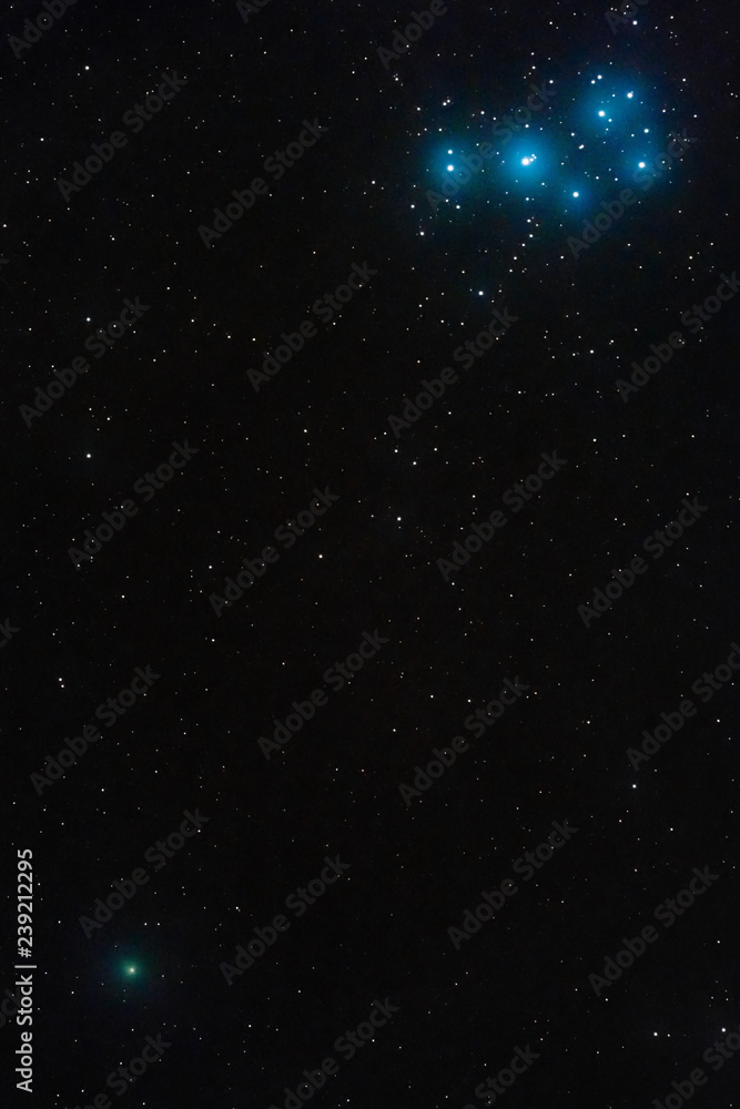 The Pleiades and the comet 46P/Wirtanen in the constellation Taurus photographed on December 15, 2018, from Mannheim in Germany.