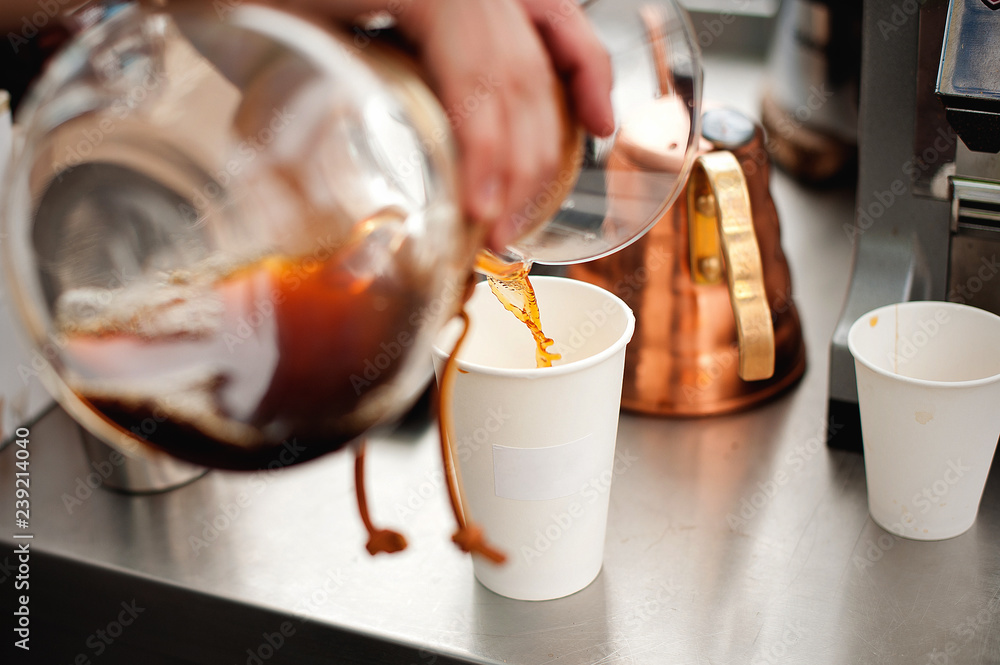 Coffee poured into a white paper cup Stock Photo | Adobe Stock