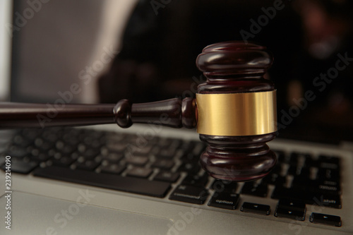 Online auction. Auction or judge gavel on a computer keyboard. 3d illustration.Close Up Of Wooden Brown Gavel On Laptop