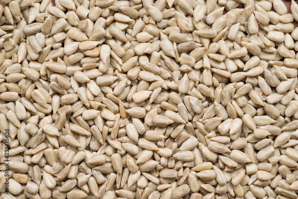 Raw sunflower seeds peeled, top view, abstract background Raw sunflower seeds peeled, top view, abstract background