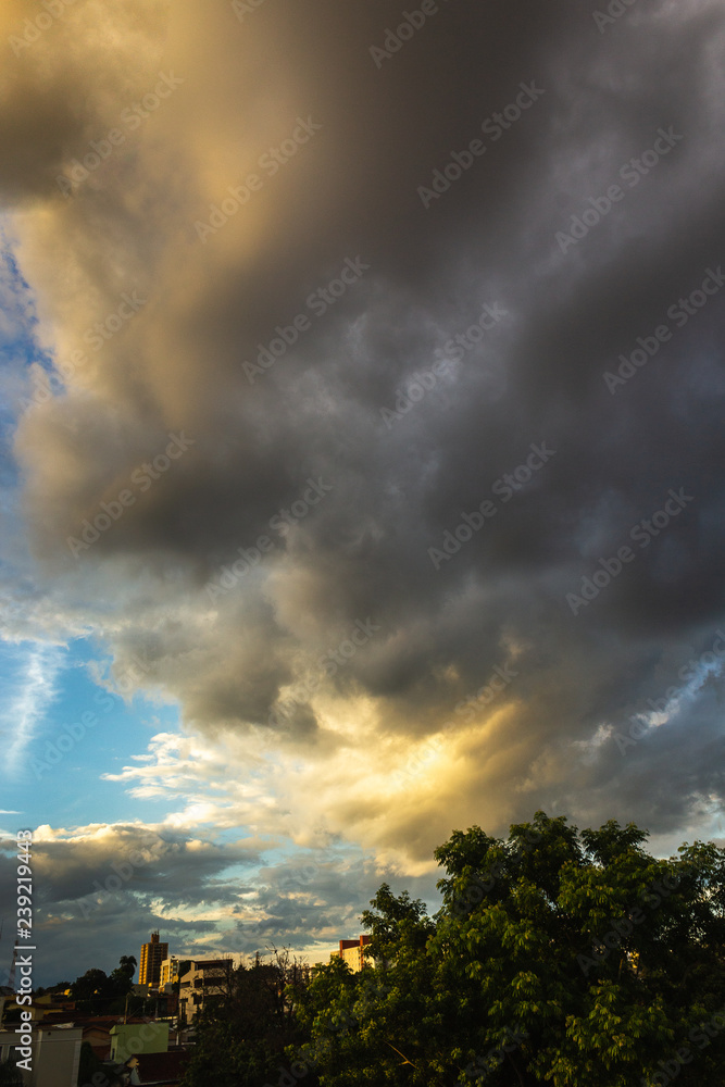 Beautiful late afternoon, Cityscape, Sunlight reflecting in clouds in yellow color.