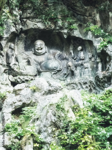 Famous Stone Sculptures of `Big Belly` Maitreya Buddha and Eighteen Lohan Monks. photo