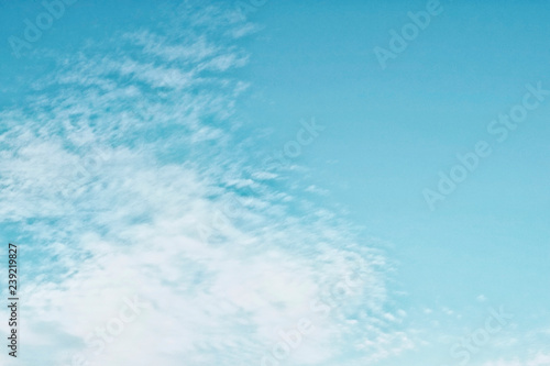 Cirrocumulus clouds in the clear bright blue sky in the afternoon
