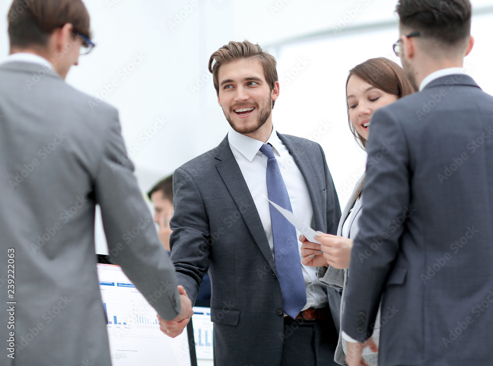 Business people shaking hands, finishing up a meeting Business people shaking hands, finishing up a meeting