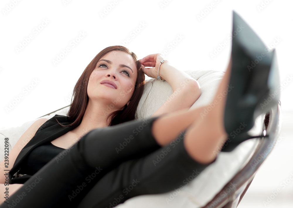 elegant business woman sitting in a comfortable chair. elegant business woman sitting in a comfortable chair.