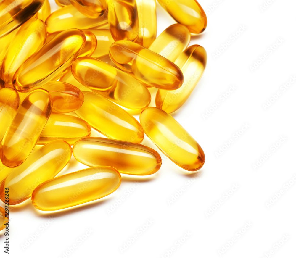 heap of fish oil capsules isolated on white background heap of fish oil capsules isolated on white background