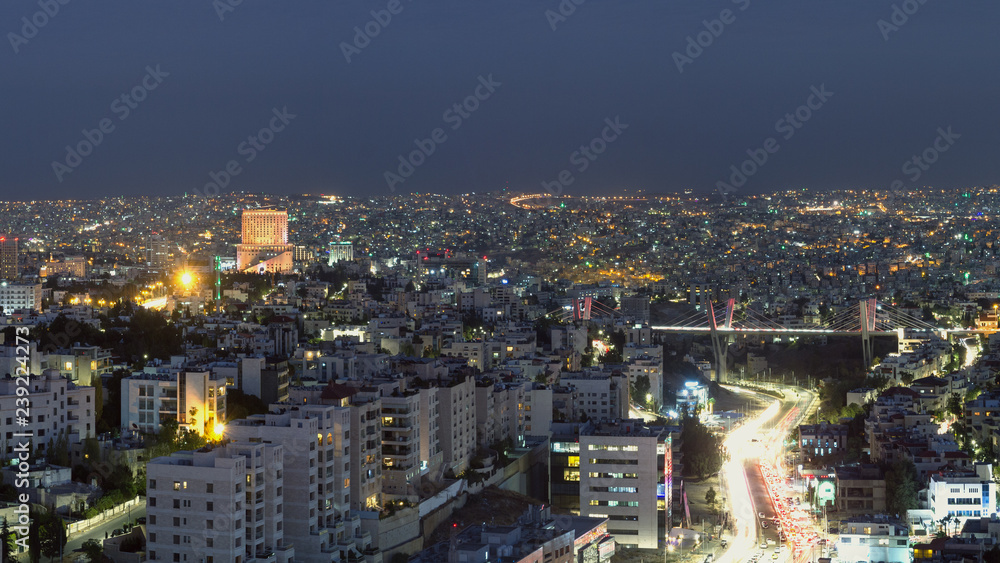 Abdoun bridge and famous 5 star hotel in Amman city at night - Aerial shot for Abdoun area and abdoun bridge