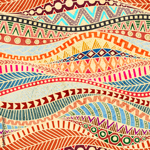 Seamless wavy pattern. Ethnic and tribal motifs. Colorful african print for textiles. Grunge texture. Ornate ornament drawn by hand. Vector illustration.