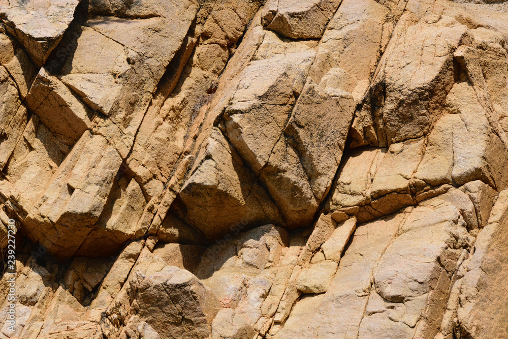 Fototapeta premium texture of the natural stone background outdoors, pattern