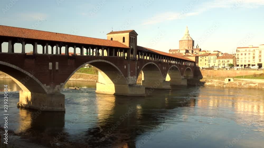 covered bridge over the flowing waters of the Ticino river in Pavia in Italy covered bridge over the flowing waters of the Ticino river in Pavia in Italy