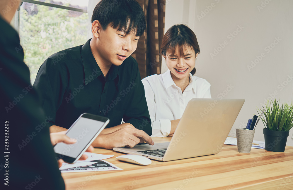 teamwork, Young businesswoman in office in casual shirt. Selecting information with colleagues with a computer. Business Marketing Planning. teamwork, Young businesswoman in office in casual shirt. Selecting information with colleagues with a computer. Business Marketing Planning.