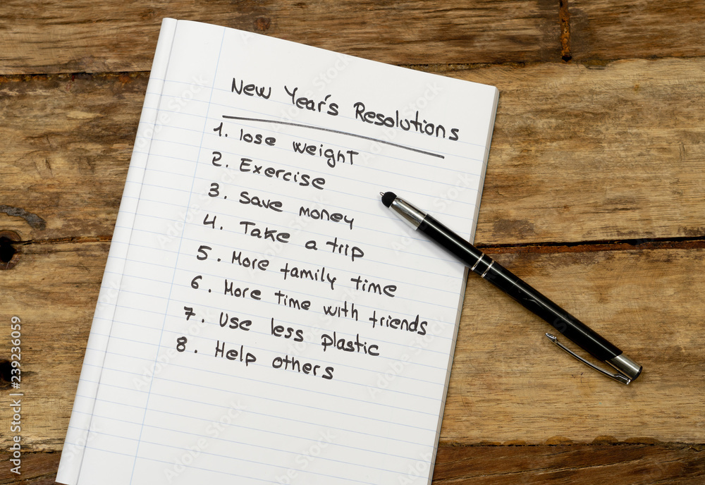 2019 New Year Resolutions list written on notebook on wood table in plans for Better life goals 2019 New Year Resolutions list written on notebook on wood table in plans for Better life goals