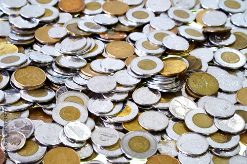 Fotografie Spare change of canadian metal money spread and filling the frame