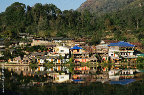 The Reflection of home town in the River, Riverside view at Rak Thai Village, Mae hong son, Thailand © Pantira