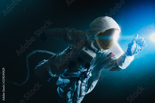 Astronaut exploring outer space photo