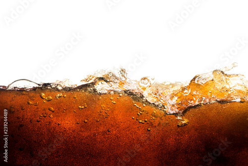 cola soda with sparkling bubbles isolated on white photo