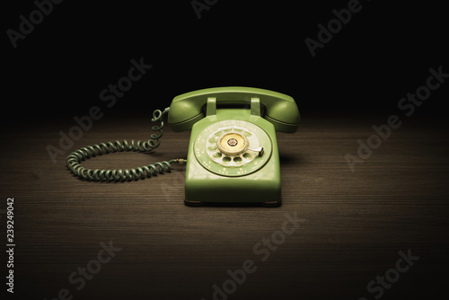 Old telephone on a wooden table