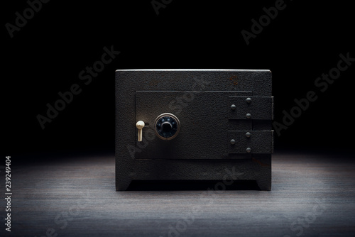 Steel bank safe on a dark background photo