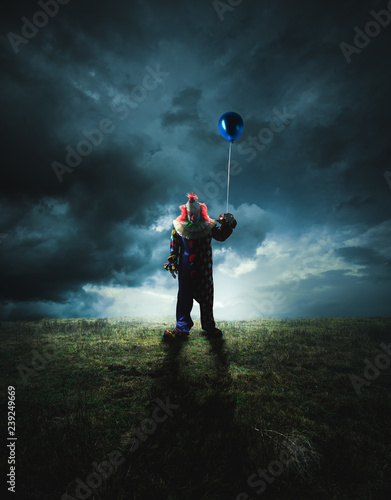 Tableau sur toile Scary clown on a dark background