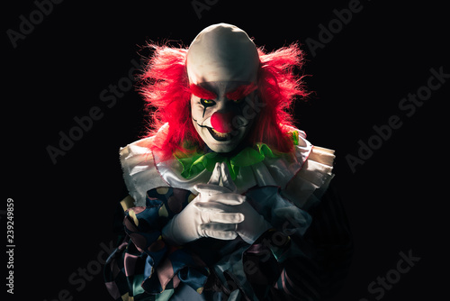 Photo Scary clown on a dark background