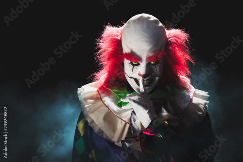 Scary clown on a dark background