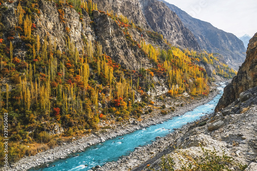 Gilgit Baltistan in autumn show colorful scenery with turquoise Hunza river flows along the Karakoram highway. Hunza valley, Pakistan.